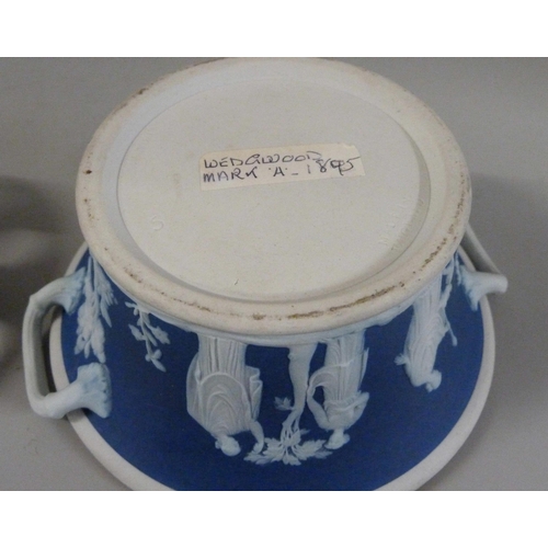 603 - Three items of Wedgwood dark blue jasper; twin handled vase, pot pourri and chamberstick