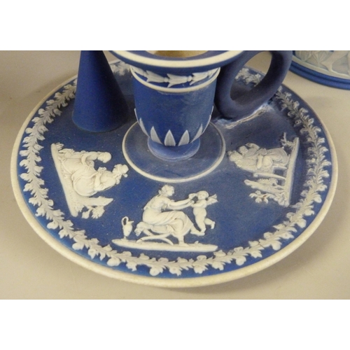 603 - Three items of Wedgwood dark blue jasper; twin handled vase, pot pourri and chamberstick