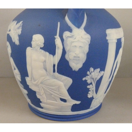 603 - Three items of Wedgwood dark blue jasper; twin handled vase, pot pourri and chamberstick