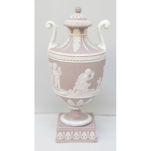 606 - A Wedgwood lilac jasper twin handled urn and cover on a square stand, 19cm