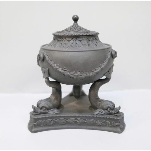 613 - A Wedgwood black basalt pastille burner, on a tripod stand with dolphin legs, 13.5cm