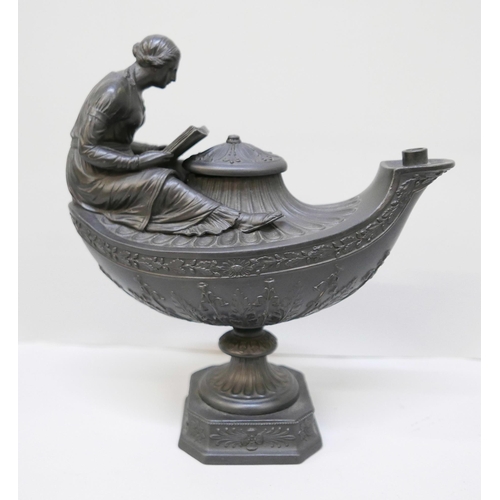 616 - A Wedgwood black basalt vestal oil lamp and cover, the female figure reading a book seated upon the ... 