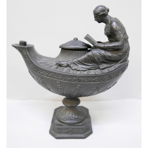 616 - A Wedgwood black basalt vestal oil lamp and cover, the female figure reading a book seated upon the ... 