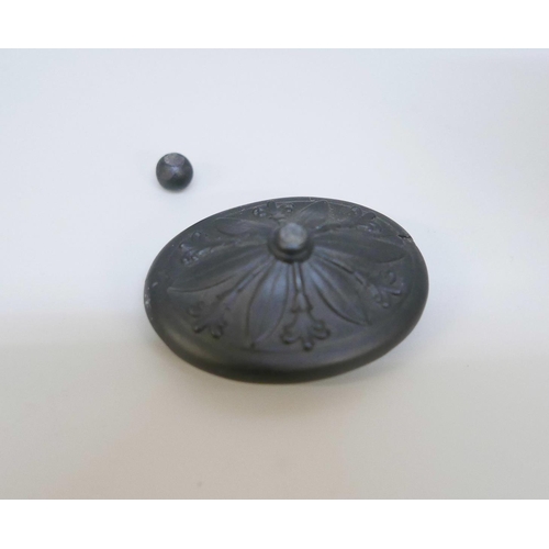 616 - A Wedgwood black basalt vestal oil lamp and cover, the female figure reading a book seated upon the ... 