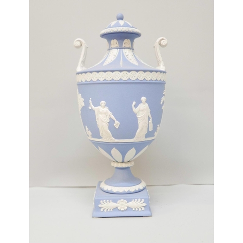 618 - A Wedgwood blue jasper twin handled urn with cover on a square plinth, 27cm