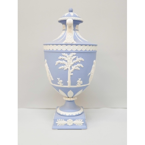 618 - A Wedgwood blue jasper twin handled urn with cover on a square plinth, 27cm