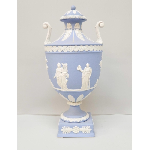 618 - A Wedgwood blue jasper twin handled urn with cover on a square plinth, 27cm