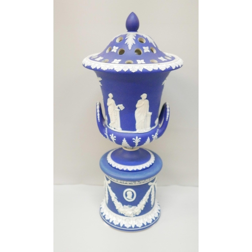 619 - A large Wedgwood dark blue jasper covered twin handled urn on a stand, with pierced cover, 42cm