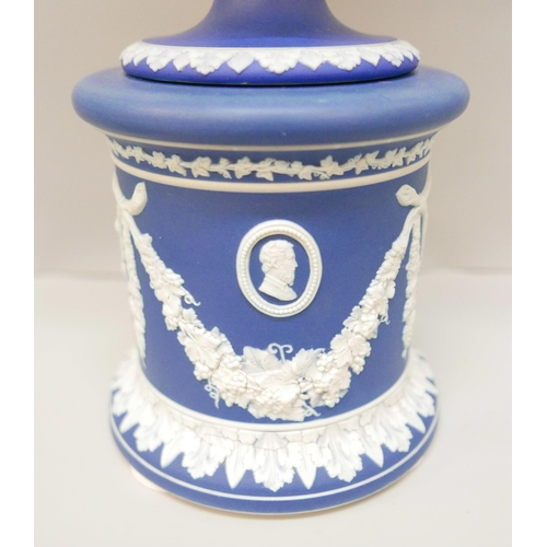 619 - A large Wedgwood dark blue jasper covered twin handled urn on a stand, with pierced cover, 42cm, lid... 