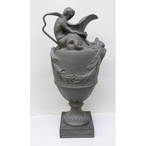 621 - A large Wedgwood black jasper wine or water ewer, modelled with Neptune seated on the shoulder of th... 