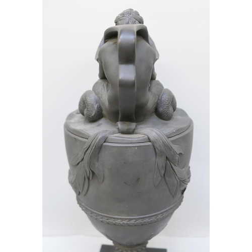 621 - A large Wedgwood black jasper wine or water ewer, modelled with Neptune seated on the shoulder of th... 