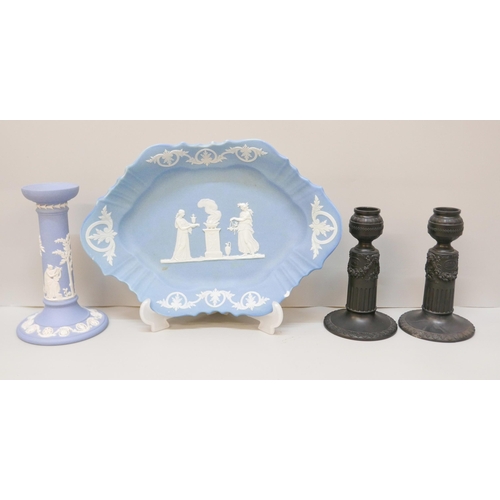 622 - A Wedgwood blue jasper dish, a/f, chip to rim, a single blue jasper candlestick and a pair of black ... 