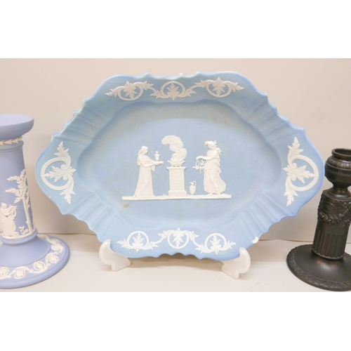 622 - A Wedgwood blue jasper dish, a/f, chip to rim, a single blue jasper candlestick and a pair of black ... 