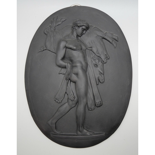 627 - A Wedgwood black basalt oval plaque, Hercules and the Erymanthian Boar, 185mm x 140mm