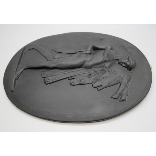 627 - A Wedgwood black basalt oval plaque, Hercules and the Erymanthian Boar, 185mm x 140mm