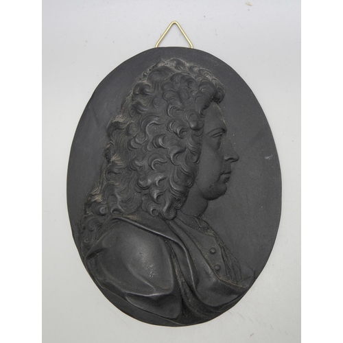 629 - A Wedgwood black basalt oval plaque of Beethoven and one other gentleman, both in profile