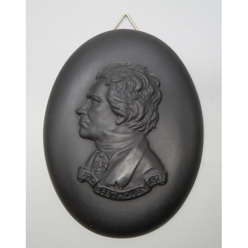 629 - A Wedgwood black basalt oval plaque of Beethoven and one other gentleman, both in profile