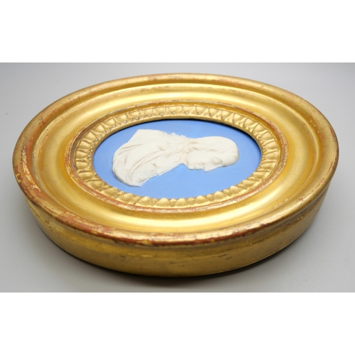 631 - A Wedgwood blue jasper oval plaque of John Milton in profile in a gilt oval frame, possible 18th cen... 