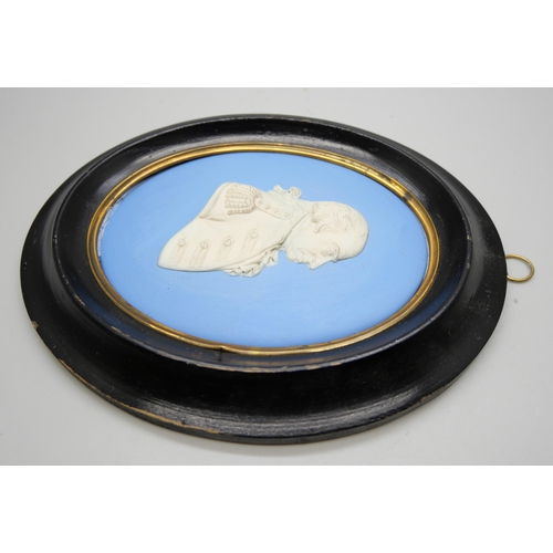 632 - A Wedgwood blue jasper oval plaque of Admiral Earl Howe in profile in an ebonised frame, frame 17cm ... 