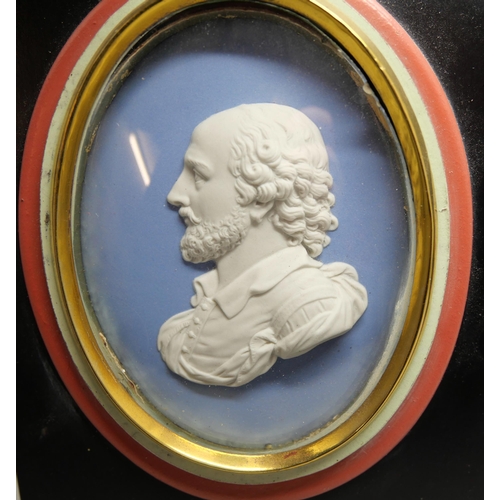 633 - Two Wedgwood blue jasper oval plaques of William Shakespeare in profile, both framed