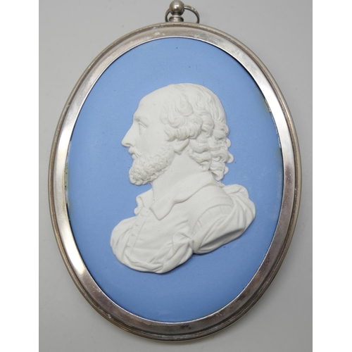 633 - Two Wedgwood blue jasper oval plaques of William Shakespeare in profile, both framed