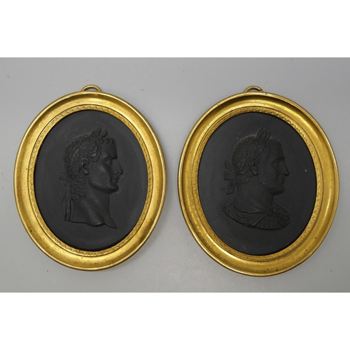 637 - Two Wedgwood black basalt oval intaglios in gilt metal frames, Caligula and Gordianni