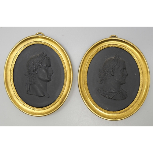 637 - Two Wedgwood black basalt oval intaglios in gilt metal frames, Caligula and Gordianni