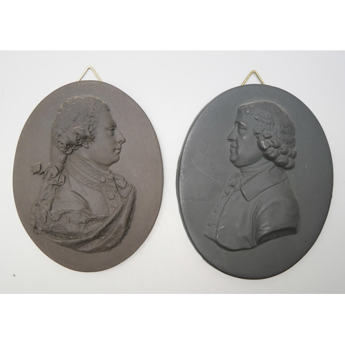 639 - Two Wedgwood black basalt oval medallions, Elliott and Josiah Wedgwood