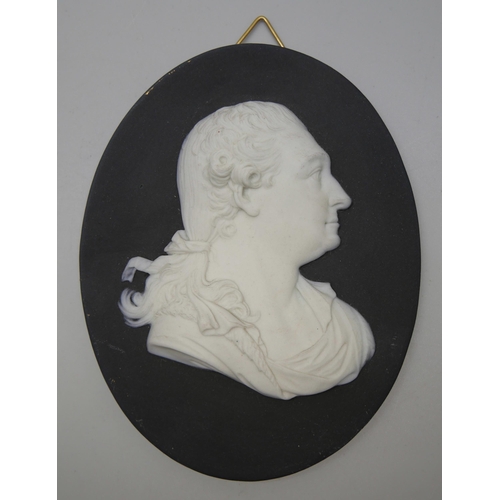 640 - A Wedgwood black and white jasper medallion, Garrick in profile