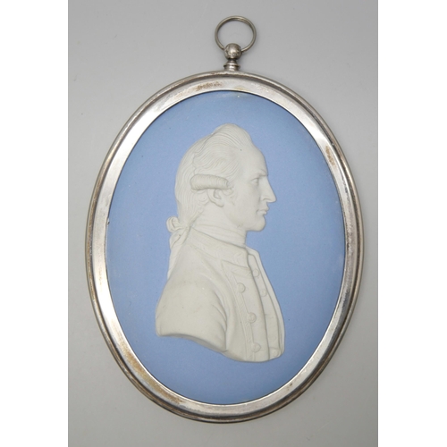 646 - A Wedgwood blue jasper oval medallion of Captain James Cook in profile, in a plated frame