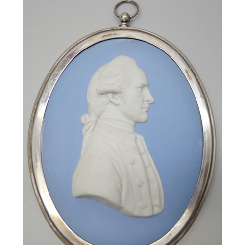 646 - A Wedgwood blue jasper oval medallion of Captain James Cook in profile, in a plated frame