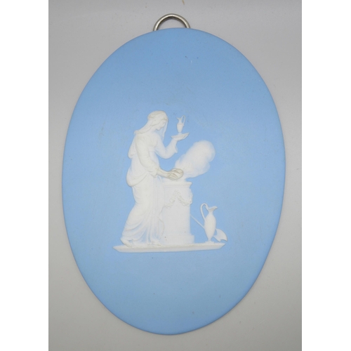 648 - Two circular and one oval Wedgwood blue jasper plaques, classical scenes