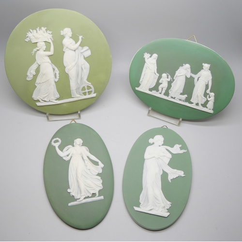 649 - Four Wedgwood green jasper plaques of classical maidens