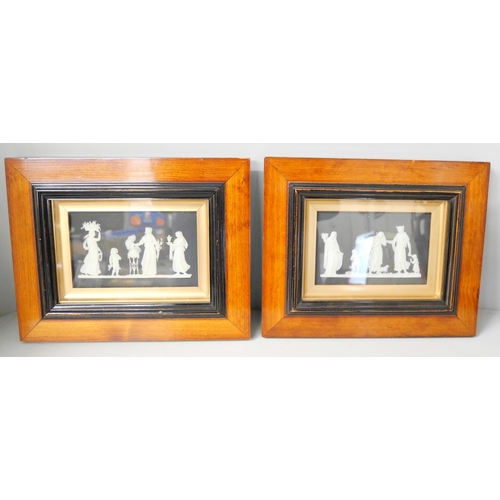 652 - Two Wedgwood black and white jasper plaques, framed