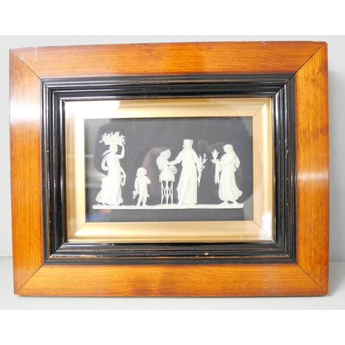 652 - Two Wedgwood black and white jasper plaques, framed