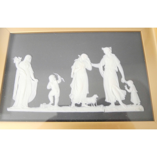 652 - Two Wedgwood black and white jasper plaques, framed