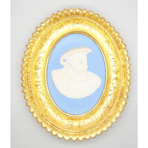 655 - A Wedgwood blue and white oval medallion, Henry VIII, a/f in a gilded frame