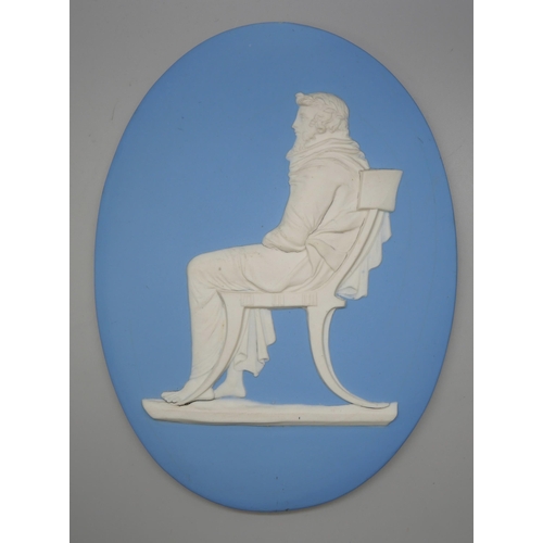 656 - A Wedgwood jasper oval plaque of a seated man in profile