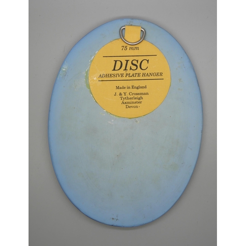 656 - A Wedgwood jasper oval plaque of a seated man in profile