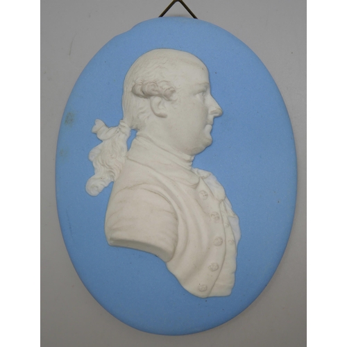 660 - Two Wedgwood blue jasper oval medallions, Mr Wyatt and one other, in profile