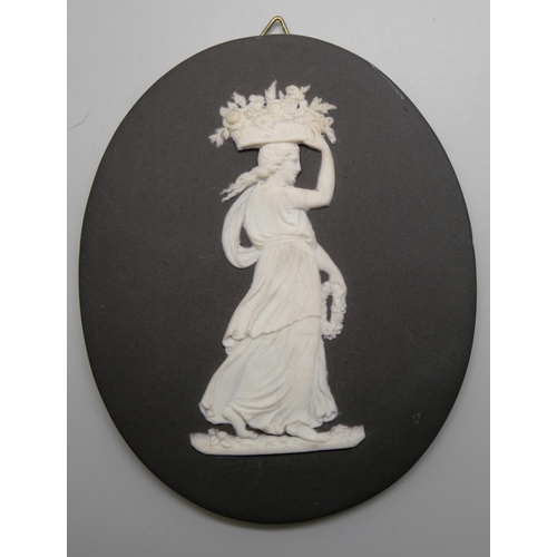 665 - Four Wedgwood black and white Jasper plaques, three rectangular, one oval