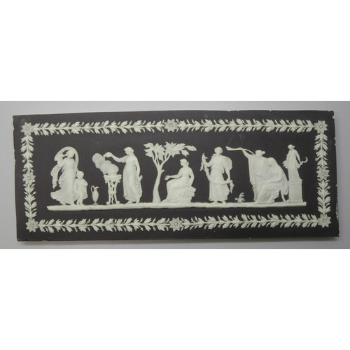 665 - Four Wedgwood black and white Jasper plaques, three rectangular, one oval