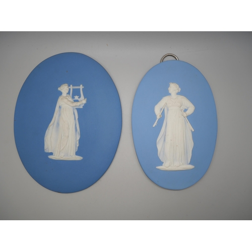 668 - Two Wedgwood blue jasper oval plaques of musicians