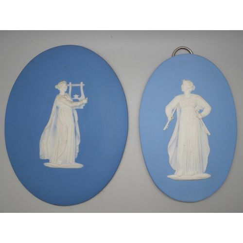 668 - Two Wedgwood blue jasper oval plaques of musicians