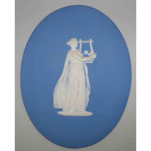 668 - Two Wedgwood blue jasper oval plaques of musicians