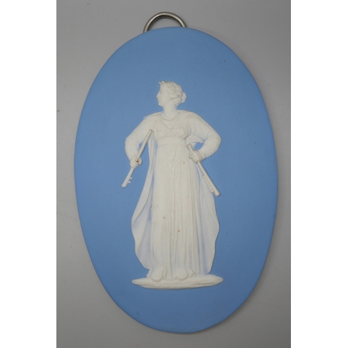 668 - Two Wedgwood blue jasper oval plaques of musicians