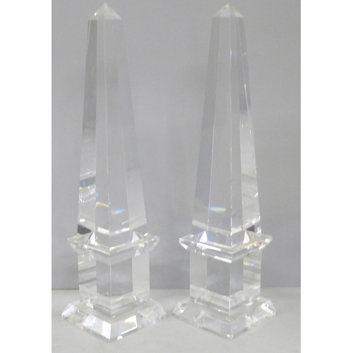 689 - A pair of crystal glass obelisks, 30cm, (a small chip to the bottom corner of one)