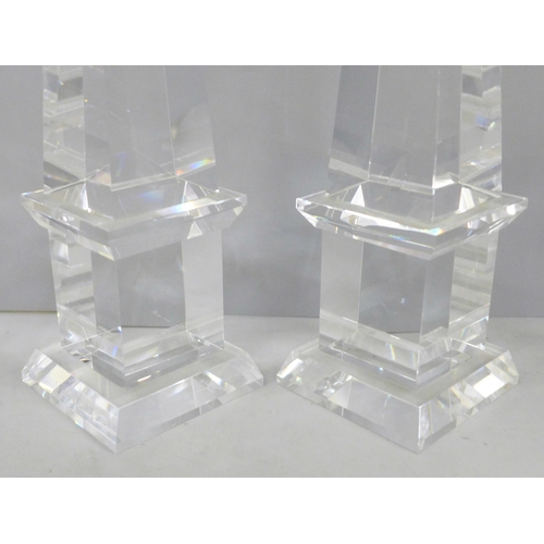 689 - A pair of crystal glass obelisks, 30cm, (a small chip to the bottom corner of one)