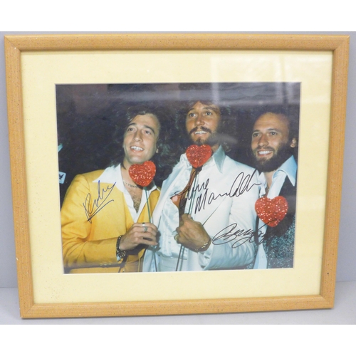 691 - The Bee Gees, signed display, 33cm wide