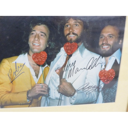 691 - The Bee Gees, signed display, 33cm wide